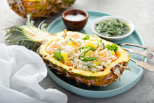 Shrimp Rice With Green Onions Served In Pineapple Boats