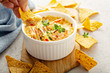 © fahrwasser - Spicy seafood dip in a ramekin with corn chips
