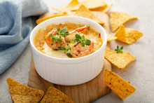 Spicy Seafood Dip In A Ramekin With Corn Chips