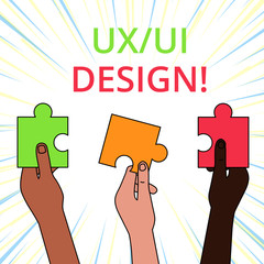 Conceptual hand writing showing Ux Or Ui Design. Concept meaning two different elements of a single consumer experience Three Colored Jigsaw Puzzle Pieces in Different People Hands