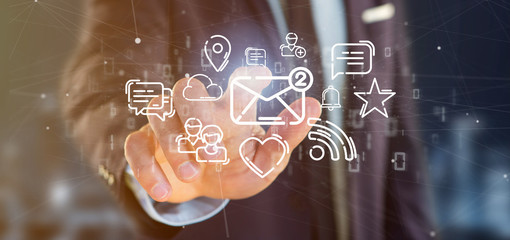 Businessman holding a cloud of social media network icon