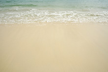 Tropical Beach With White Coral Sand And Calm Wave With Space For Text Background                   