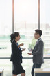 © Bangkok Click Studio - Business people sitting and drinking coffee..