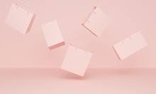 Pink background with flying shopping bags. 3d rendering