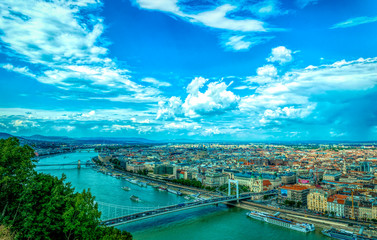 Poster - Budapest, Hungary - July 14, 2019: the Danube River bridges and the panorama of Budapest, the capital of Hungary, in the summer. A tourist trip to the ancient metropolitan cities of Europe