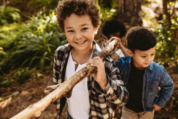 Poster - Children building camp in forest