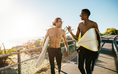 Best friends going on surfing