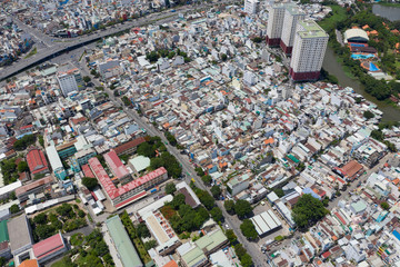 Top View of Building in a City - Aerial view Skyscrapers flying by drone of Ho Chi Mi City with development buildings, transportation, energy power 