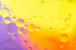 © photollurg - oily drops in water with colorful background, close-up