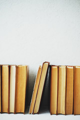 Wall Mural - minimalism, old books on the white background