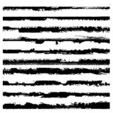 Fototapeta Młodzieżowe - A set of grunge brushes. Black ragged stripes on white background. Abstract stains from paint roller