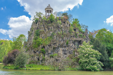 Paris, France - 05 12 2019: The park Buttes-Chaumont. Temple of Sybille and the impressive cliff