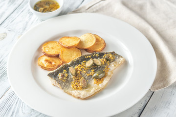 Wall Mural - Baked sea bass with capers