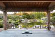 © Trinette Reed/Stocksy - Meditation cushion in Japanese meditation garden