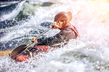 Wall Mural - Whitewater kayaking, extreme sport rafting. Guy in kayak sails mountain river