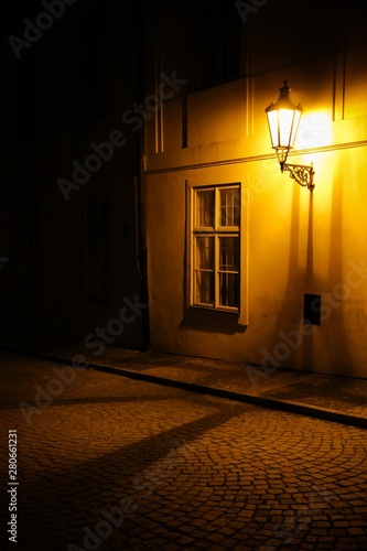 Old Lantern Illuminating A Dark Alleyway Medieval Street At Night In Prague Czech Republic Low Key