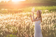© weerasak - Beauty Girl Outdoors enjoying nature. Beautiful Teenage Model girl in white dress running on the Spring Field, Sun Light.