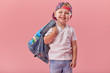 © oes - Little serious fashionable toddler boy in denim clothes and trendy cap. Isolated on pink background