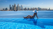 Beautiful panorama of Dubai Marina skyline in a background with a pool, deck chair and woman with a white hat.