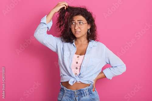 Picture Of Confused Beautiful Young Brunette Woman Wavy Hair