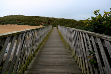  Wooden Footbridge Over a River Estuary to the Beach