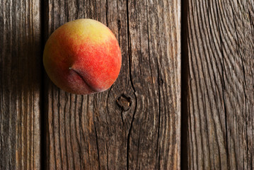 Canvas Print - peach fruit on old weathered wooden table background