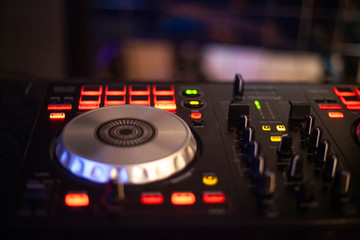 DJ control. Musical equipment. A tool for giving sound. The main thing in a disco is a music console for editing music.DJ control. Musical equipment. A tool for giving sound. The main thing in a disco