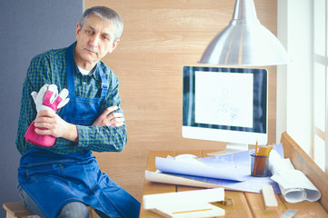 Engineer carpenter working on laptop and sketching project