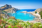 Fototapeta  - Lindos – panoramic view of St. Paul bay with acropolis of Lindos in background (Rhodes, Greece)