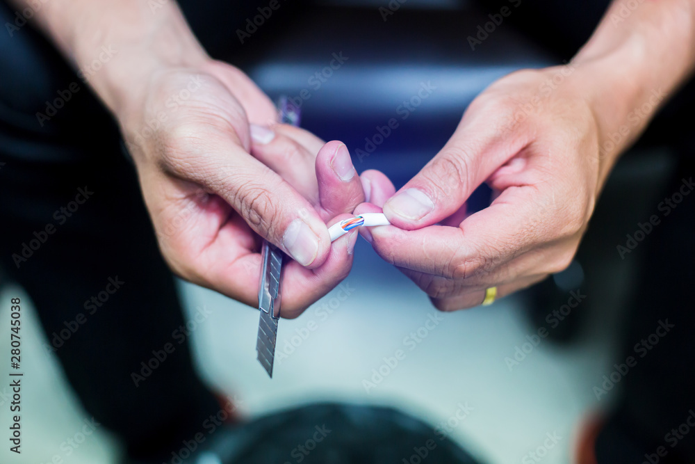 Cutter knives is cutting insulated of UTP cable. Connection procedure ...