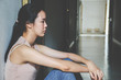 © TeTe Song - depression young girl teenager having abused problem feeling suffering sitting alone in the dark room, Domestic violence, family problems, Stress, violence, The concept of depression and suicide..