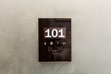 Electronic hotel room access panel with room number