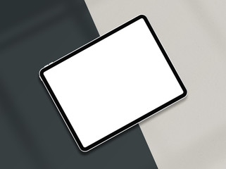 Tablet with empty screen. Tablet mockup on minimal background. Modern tablet display mockup scene. Top view. Photo mockup with clipping path.
