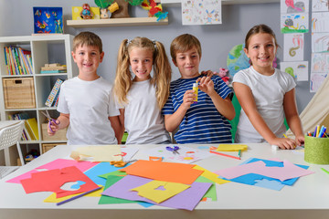 Wall Mural - Creative projects with children at home or at school. Kids making some paper crafts. 