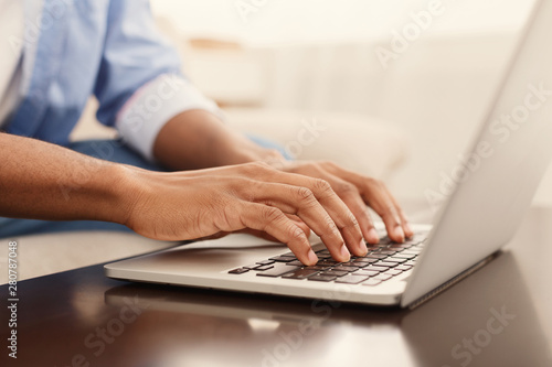 Fotografía Male hands typing text or programming code on laptop