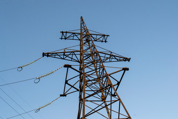 Wall Mural - high-voltage metal tower against the sky