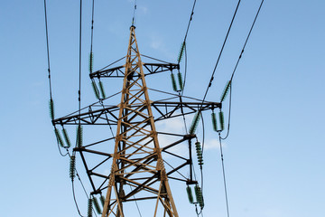 high-voltage metal tower against the sky