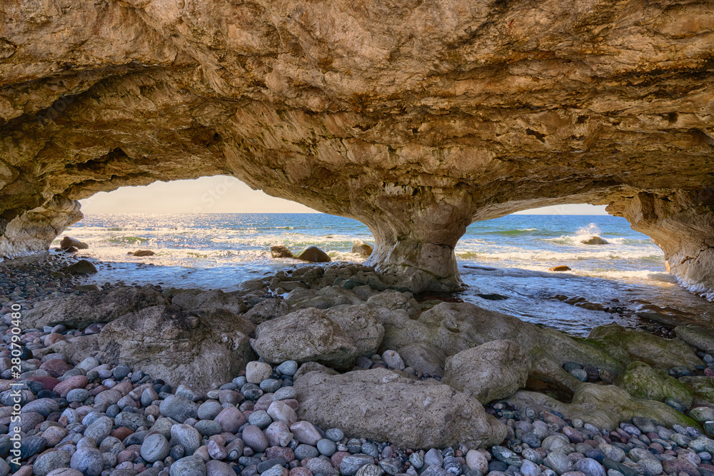 Natural stone arches along the ocean in Arches Provincial Park in ...