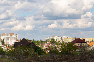 Wall Mural - Outskirts of Chisinau. Panorama with the capital of Moldova. Cloudy sky before the rain.	