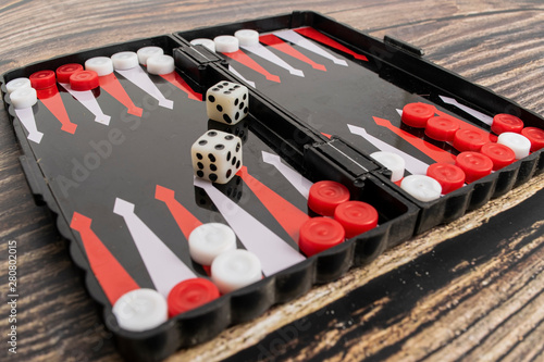 Cuadros en Lienzo Small pocket backgammon on a wooden table