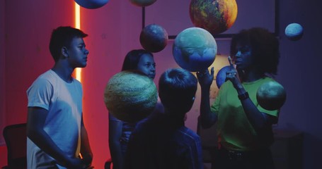 Wall Mural - Teacher explaining astronomy to students