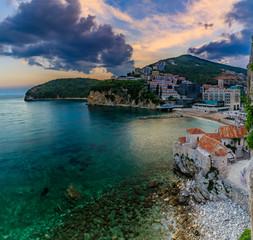 Budva Old Town from the Citadel with Richard s Head beach and Adriatic Sea at sunset in Montenegro, Balkans