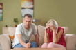 Quarrelling middle-aged couple at home