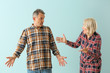 © Pixel-Shot - Quarrelling middle-aged couple on color background