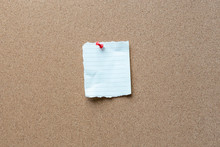 Note Paper With Tack On A Cork Bulletin Board