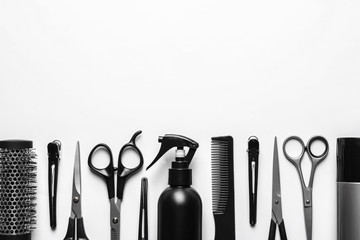 Wall Mural - Composition with scissors and other hairdresser's accessories on white background, top view