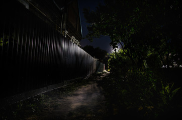 Wall Mural - full moon over quite village at night. beautiful night landscape of old town street with lights. rus