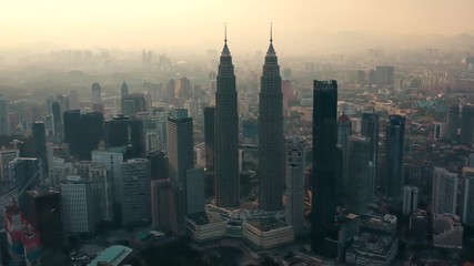 drone aerial view 4k footage of kuala lumpur city skyline on sunset in malaysia.