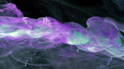 Wall Mural - Slow motion of Liquid ink on black background. 