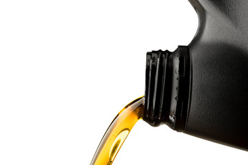 Wall Mural - Pouring oil lubricant motor car from black bottle on isolated white background